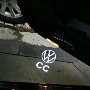 VW CC door lights projecting a sharp, crisp white Volkswagen CC logo onto the ground from the frameless car door.