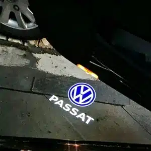 VW Passat door puddle lights projecting a bright white Volkswagen logo onto the ground.