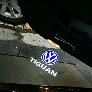 VW Tiguan door puddle lights projecting the crisp white Volkswagen logo onto the ground.