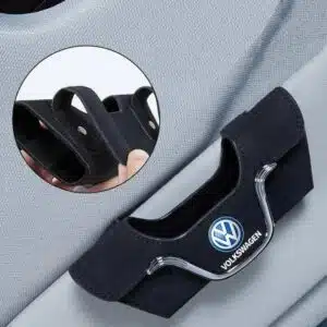 VW sunglasses holder black version clipped onto sun visor — matches dark Golf GTI Tiguan interiors