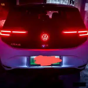 VW ID.3 rear LED emblem lit up at night showing clean Red glow on badge