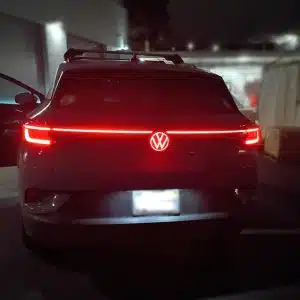 VW ID.5 rear LED emblem lit up at night showing clean Red glow across badge